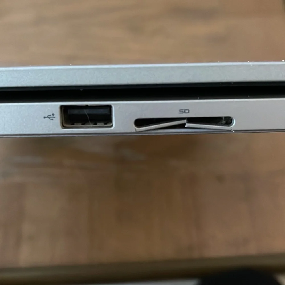 Silver Dell laptop that folds over to a tablet